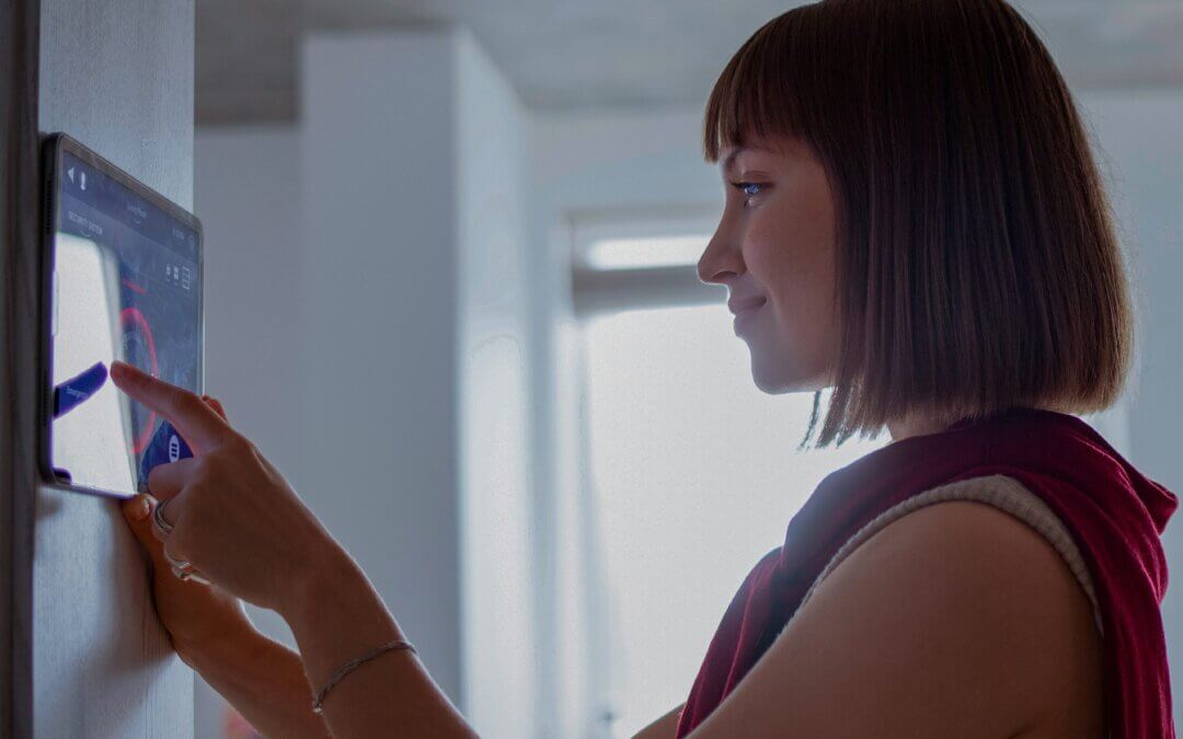 Woman Adjusting Thermostat